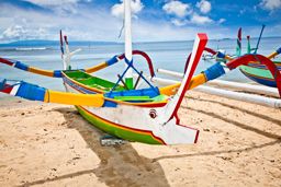 Traditional fishing boats on a beach in Nusa Dua on Bali. Indonesia