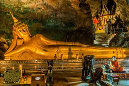Statue of Reclining Buddha in buddhist suwankuha temple Phang Nga in Phuket island, Thailand