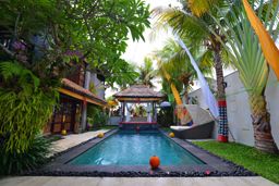 Modern tropical villa with swimming pool and celebration decorations
