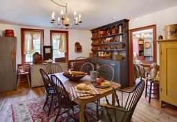 A dining room in a primitive colonial style reproduction home, late 1700's