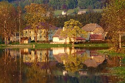 Reflection of old house in the lake