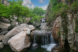 Cascading waterfall over natural rocks