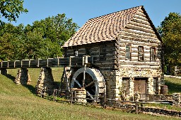 A log and stone mill at Shoal Creek Living History Museum in Kansas City, Missouri